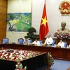 Thủ tướng Nguyễn Xuân Phúc, Chủ tịch Ủy ban Quốc gia về biến đổi khí hậu chủ trì cuộc họp lần thứ 8 về biến đổi khí hậu. (Ảnh: Thống Nhất/TTXVN)