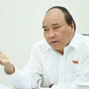 Thủ tướng Nguyễn Xuân Phúc chủ trì cuộc họp với các bộ, ngành về các kịch bản tăng trưởng năm 2017. (Nguồn: Chinhphu.vn)