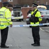 Cảnh sát phong tỏa lối vào một tuyến phố ở Moss Side thuộc Manchester - khu vực có liên quan đến vụ đánh bom ở sân vận động Manchester Arena ngày 28/5. (Nguồn: AFP/TTXVN)
