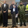 Tổng thống Colombia Juan Manuel Santos (giữa) thông báo số người thiệt mạng trong vụ đánh bom xảy ra sáng 18/6 (theo giờ Hà Nội) tại trung tâm thương mại Centro Andino ở thủ đô Bogota. (Nguồn: AFP/TTXVN)