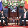Chủ tịch nước Trần Đại Quang tiếp ông Phankham Viphavan, Ủy viên Bộ Chính trị, Thường trực Ban Bí thư, Phó Chủ tịch nước Lào. (Ảnh: Nhan Sáng/TTXVN)