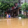 Nước sông Thao dâng cao gây ngập lụt nhiều khu vực tại thành phố Yên Bái. (Ảnh: Thế Duyệt/TTXVN)