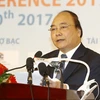Thủ tướng Chính phủ Nguyễn Xuân Phúc phát biểu tại hội nghị. (Ảnh: Thống Nhất/TTXVN)