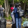Người di cư Haiti chuẩn bị vượt biên để vào Canada ngày 4/8. (Nguồn: AFP/TTXVN)