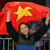 Nữ võ sỹ Phạm Thị Tươi ăn mừng sau khi giành được tấm huy chương vàng. (Ảnh: Quốc Khánh/TTXVN)