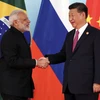Chủ tịch Trung Quốc Tập Cận Bình đón tiếp Thủ tướng Ấn Độ Narendra Modi tại hội nghị BRICS ở Hạ Môn, Trung Quốc. (Nguồn: EPA/TTXVN)