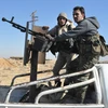 Ảnh tư liệu: Các lực lượng Syria trong chiến dịch chống IS ở tỉnh Homs ngày 7/2. (Nguồn: AFP/TTXVN)