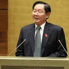 Bộ trưởng Bộ Nội vụ Lê Vĩnh Tân phát biểu tại phiên họp. (Ảnh: Phương Hoa/TTXVN)