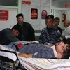 Một nạn nhân trận động đất được điều trị tại bệnh viện ở Sulaimaniyah ngày 12/11. (Nguồn: AFP/ TTXVN)