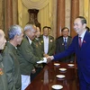 Chủ tịch nước Trần Đại Quang tiếp Đoàn đại biểu các công dân Lào có công với cách mạng Việt Nam. (Ảnh: Nhan Sáng/TTXVN)