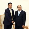 Thủ tướng Nguyễn Xuân Phúc tiếp ông Thẩm Thiên Tinh, Chủ tịch Tập đoàn Giai Nguyên (Hong Kong, Trung Quốc). (Ảnh: Thống Nhất/TTXVN)