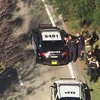 Cảnh sát bắt giữ nghi can gây ra vụ xả súng. (Nguồn: .fox13news.com)
