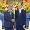 Chủ tịch nước Trần Đại Quang tiếp Chủ nhiệm Văn phòng Chủ tịch nước Cộng hòa Dân chủ Nhân dân Lào Khammeung Phongthady. (Ảnh: Nhan Sáng/TTXVN)