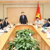 Phó Thủ tướng Vương Đình Huệ chủ trì cuộc họp Tổ điều hành kinh tế vĩ mô. (Ảnh: Lâm Khánh/TTXVN)