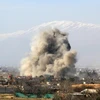 Ảnh tư liệu: Khói bốc lên sau một vụ không kích ở phía tây bắc thủ đô Damascus, Syria. (Nguồn: AFP/ TTXVN)