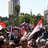 Người dân Syria đã đổ xuống đường phố Aleppo, bày tỏ sự ủng hộ Tổng thống Bashar al-Assad và quân đội Chính phủ, ngày 14/4. (Nguồn: AFP/TTXVN)