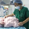 Ca phẫu thuật thành công với việc 3 bé gái chào đời. (Ảnh: Thanh Sang/TTXVN)