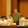 Bộ trưởng Bộ Công an Tô Lâm trả lời chất vấn của các đại biểu Quốc hội. (Ảnh: Dương Giang/TTXVN)
