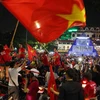 Người dân Hà Nội xuống đường ăn mừng chiến thắng của đội Olympic Việt Nam trước Olympic Bahrain ở ASIAD 2018. (Ảnh: Thành Đạt/TTXVN)