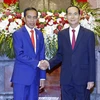 Chủ tịch nước Trần Đại Quang và Tổng thống Indonesia Joko Widodo tại lễ đón. (Ảnh: Nhan Sáng/TTXVN)