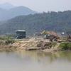 Điểm mỏ khai thác cát của doanh nghiệp tư nhân Nam Sơn cách di tích Thành Tam Vạn khoảng 30 mét. thuộc đội 6, xã Pom Lót (huyện Điện Biên). (Ảnh: Xuân Tiến/TTXVN)