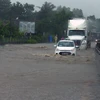 Quốc lộ 1 (đoạn qua địa phận thị trấn Chí Thạnh, huyện Tuy An) bị ngập sâu. (Ảnh: Xuân Triệu/TTXVN)
