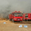 Hơn 100 cán bộ và 7 xe chữa cháy đã được điều động đến hiện trường. (Ảnh: Nguyễn Oanh/TTXVN)