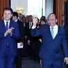 Thủ tướng Nguyễn Xuân Phúc và Thủ tướng Cộng hòa Italy Giuseppe Conte tới dự Diễn đàn Doanh nghiệp ASEAN-Italy. (Ảnh: Thống Nhất /TTXVN)