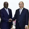 Thủ tướng Nguyễn Xuân Phúc tiếp Bộ trưởng Ngoại giao nước Cộng hòa Côte d'Ivoire Marcel Amon Tanoh đang có chuyến thăm chính thức Việt Nam. (Ảnh: Thống Nhất/TTXVN)
