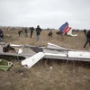 Xác máy bay MH17 của Hãng hàng không Malaysia Airlines bị bắn rơi gần làng Grabove, cách Donetsk, miền Đông Ukraine khoảng 80km, tháng 11/2014. (Nguồn: AFP/TTXVN)