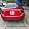 Biển kiểm soát 61A 666.66 thuộc xe nhãn hiệu Mazda màu đỏ do anh Trương Hoài Ân bốc thăm ngẫu nhiên. (Ảnh: Nguyễn Văn Việt/TTXVN)