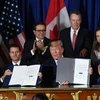 Ảnh tư liệu, từ trái sang: Tổng thống Mexico Enrique Pena Nieto, Tổng thống Mỹ Donald Trump và Thủ tướng Canada Justin Trudeau tại lễ ký Thỏa thuận thương mại tự do Mỹ-Mexico-Canada (USMCA) tại Buenos Aires (Argentina) ngày 30/11/2018. (Nguồn: AFP/TTXVN)