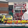 Cảnh sát Anh điều tra tại hiện trường phát hiện xe container chở 39 thi thể ở khu công nghiệp Waterglade của thị trấn Grays, hạt Essex, Anh ngày 23/10/2019. (Nguồn: THX/TTXVN)