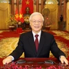 Tổng Bí thư, Chủ tịch nước Nguyễn Phú Trọng đọc Thư chúc Tết. (Ảnh: Trí Dũng/TTXVN)