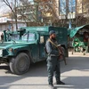 Nhân viên an ninh gác tại hiện trường một vụ nổ súng tại Kabul, Afghanistan, ngày 6/3. (Nguồn: THX/TTXVN)