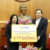 Ngân hàng SHB chung tay ủng hộ chống dịch COVID-19. (Ảnh: PV/Vietnam+)
