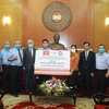 Lễ trao tiền ủng hộ của Tổng hội Thương mại Đài Loan tại Việt Nam tới Ủy ban Trung ương Mặt trận Tổ quốc Việt Nam. (Nguồn: Vietnam+) 