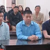 Bị cáo Lâm Hữu Sơn (giữa) cùng các đồng phạm tại phiên xử sơ thẩm tháng 9/2019. (Nguồn: Báo Sài Gòn giải phóng)