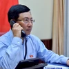Phó Thủ tướng Phạm Bình Minh điện đàm. (Nguồn: TTXVN)