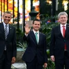 Tổng thống Mỹ Barack Obama (trái), Tổng thống Mexico Enrique Pena Nieto (giữa), Thủ tướng Canada Stephen Harper (phải) tại hội nghị. (Nguồn: AFP-TTXVN)