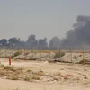 Trong ảnh: Khói bốc lên từ cơ sở lọc dầu của Aramco tại Abqaiq, Saudi Arabia, sau vụ tấn công ngày 14/9/2019. (Nguồn: AFP/TTXVN)