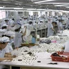 Công nhân làm việc tại khu công nghiệp liên Triều Kaesong. (Nguồn: darkgovernment.com)