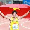 Niềm vui của vận động viên Nguyễn Văn Lai sau khi về đích. (Ảnh: Quốc Khánh/TTXVN)
