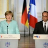 Tổng thống Francois Hollande (phải) và Thủ tướng Angela Merkel tại cuộc họp báo chung sau cuộc gặp. (Nguồn: THX/TTXVN)