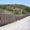 Thổ Nhĩ Kỳ xây dựng một bức tường chống các vụ bắn rocket dọc theo biên giới với Syria. (Nguồn: DHA)