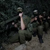 Các thành viên Lữ đoàn al-Qassam, một cánh vũ trang của phong trào Hamas tham gia huấn luyện tại Dải Gaza. (Nguồn: THX/TTXVN)