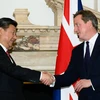 Chủ tịch Trung Quốc Tập Cận Bình (trái) và Thủ tướng Anh David Cameron. (Nguồn: ZUMA PRESS)