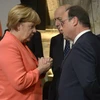Thủ tướng Đức Angela Merkel (trái) và Tổng thống Pháp Francois Hollande tại một hội nghị. (Nguồn: AFP/TTXVN)