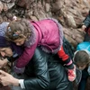 Người tị nạn Syria tới đảo Lesbos, Hy Lạp sau cuộc hành trình vượt biển Aegean từ Thổ Nhĩ Kỳ. (Nguồn: Reuters/TTXVN)