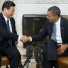 Chủ tịch Trung Quốc Tập Cận Bình (trái) và Tổng thống Mỹ Barack Obama. (Nguồn: huffingtonpost.com)